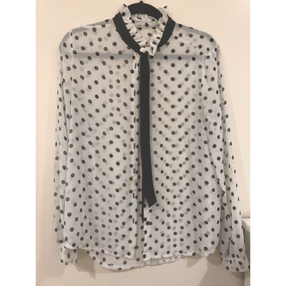 White and black polka dot blouse.